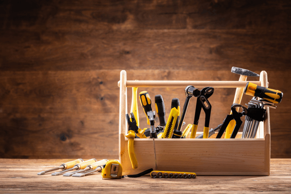 image of a wooden toolbox with tools inside