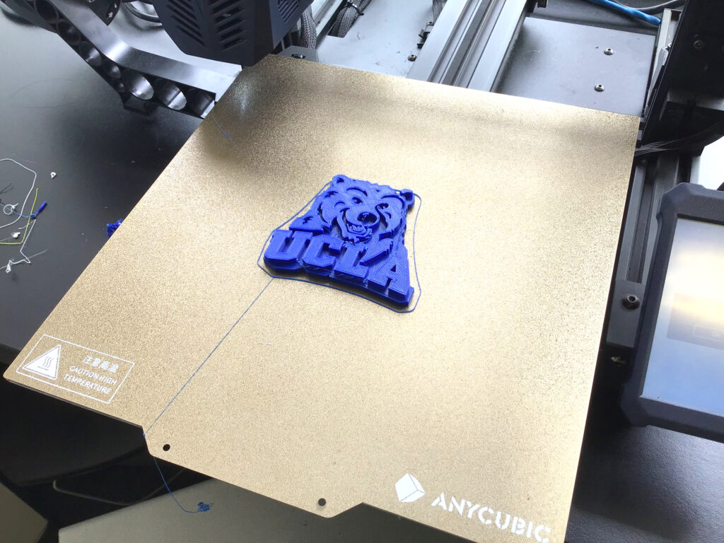 3d printed UCLA Bear logo in blue plastic